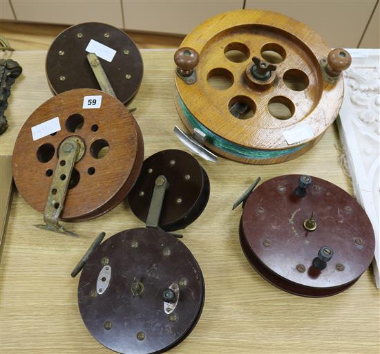 Six various fishing reels, largest 30cm